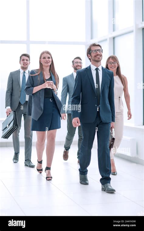 Confident Businessman And His Business Team Passing Through The Office