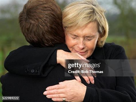 Crying Woman Hugging Man High-Res Stock Photo - Getty Images