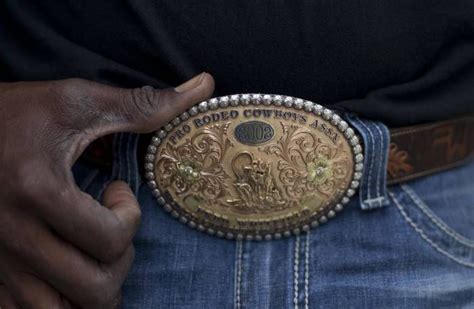 Fred Whitfield Wears His 2002 World Champion Tie Down Roper Belt Buckle