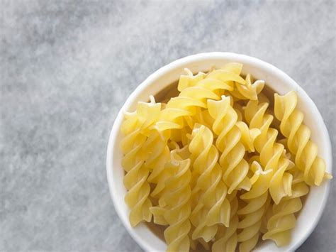 Premium Photo Close Up Of Fusilli Pasta On Table