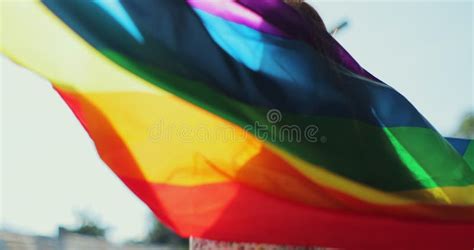 Woman Holding The Rainbow Flag And Enjoying Blue Sky Beautiful The