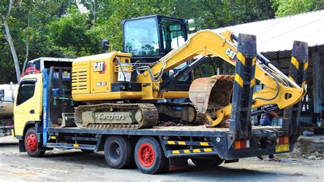 Mini Excavators Transported With Mini Self Loader Truck Youtube