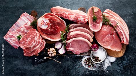 Different types of raw meat on black background Stock Photo | Adobe Stock