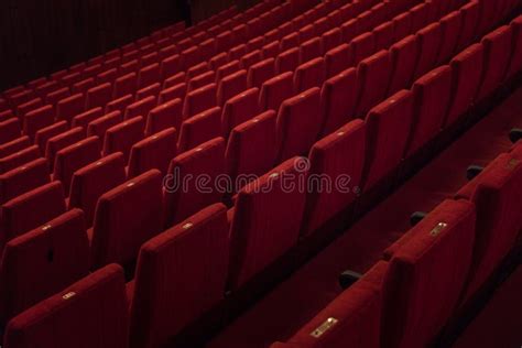 Red theater chairs stock photo. Image of comedy, velvet - 99886832