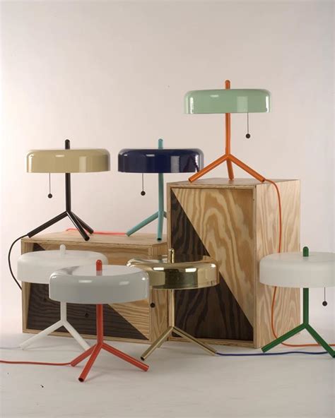 Several Different Colored Lamps Sitting Next To Each Other On Top Of A