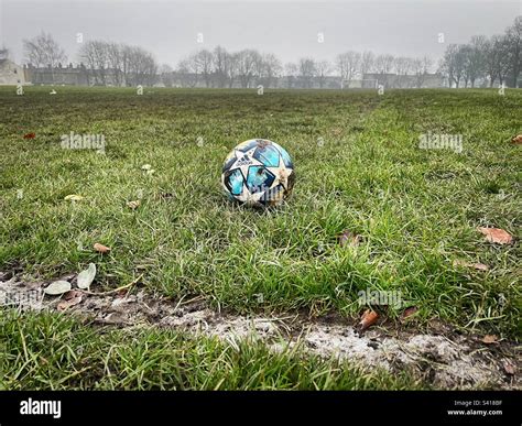 ‘grassroots A Football Sits Close To The Touchline On A Muddy And Overgrown Local Pitch Stock