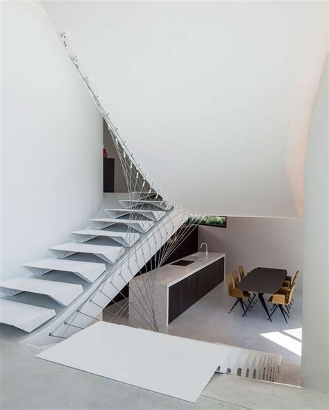 Office O Architects Sculpts Villa Mq From Curved Concrete Stairs