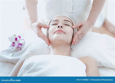 Female Massage Therapist Giving A Massage At A Spa Young Woman