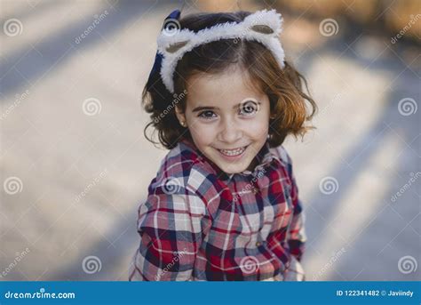 Adorable Little Girl Smiling Outdoors. Stock Photo - Image of casual, summer: 122341482