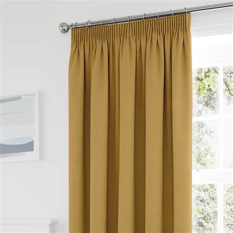 Tyla Ochre Thermal Blackout Pencil Pleat Curtains | Dunelm