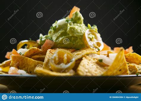 Nachos with guacamole. stock photo. Image of delicious - 266804384