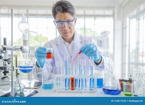 Researcher Working In Laboratary Scientists Are Experimenting With