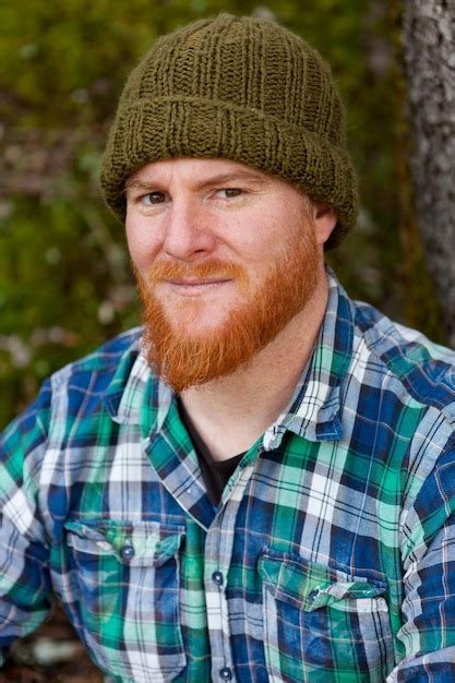 Premium Photo Portrait Of Smiling Man Wearing Hat