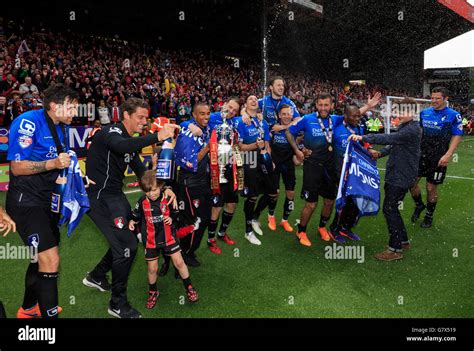 Bournemouths Players Celebrate With The Championship Trophy During