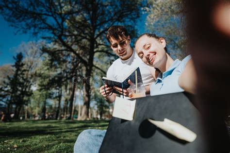 High School Students Collaborating On A Project At The Campus Park