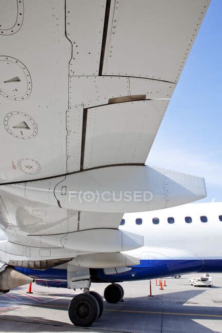 The wing flaps and structures of an aircraft wing. — outdoors, airport - Stock Photo | #502283488