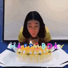 Girl Carefully Blowing Birthday Candles GIF | GIFDB.com