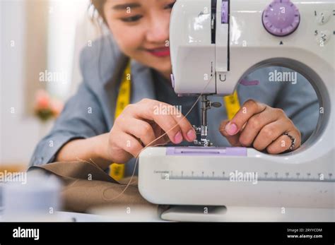 Closeup Of Attractive Female Fashion Designer Hand Working Workshop