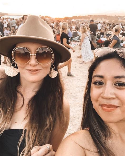 Two Women Enjoying An Outdoor Music Festival