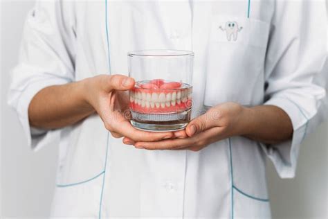 Prosthesis In A Glass With A Solution Dental Prosthesis Care Full