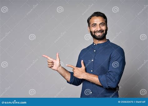 Happy Indian Business Man Pointing Fingers Advertising Isolated On Gray