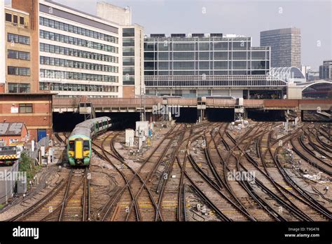 Passenger train arriving at London Victoria Station, London, England ...