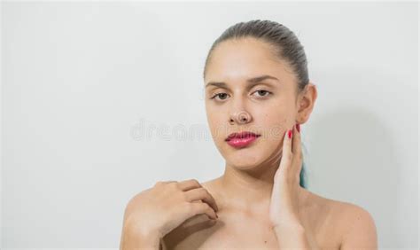 Portrait Of A White Colombian Naked Girl Posing Against A White