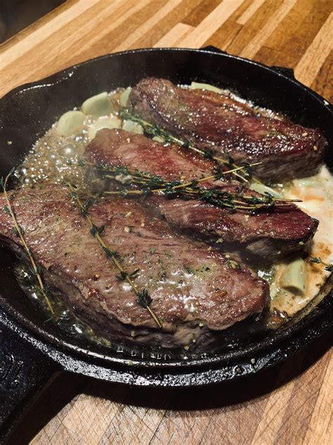 Cast Iron Picanha in goat butter, pickled garlic and thyme. | Scrolller