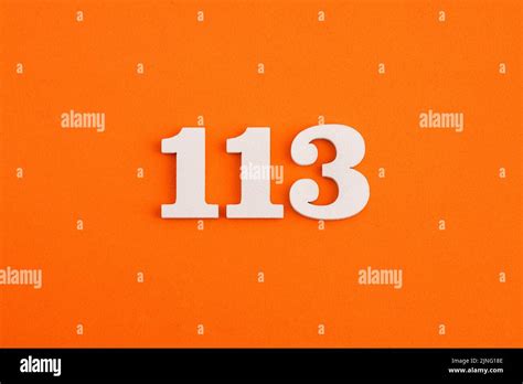 Number 113 - On orange foam rubber background Stock Photo - Alamy