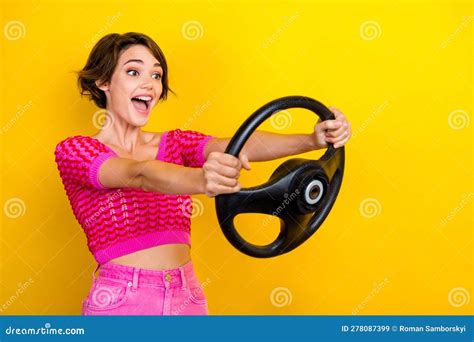 Photo Of Overjoyed Funny Girl Wear Pink Crop Top Knitted Hold Steering Wheel Crazy Fast Speed