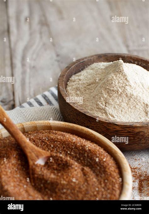 Teff flour and teff grain in bowls close up Stock Photo - Alamy