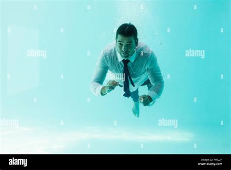 Businessman Swimming Underwater Stock Photo Alamy