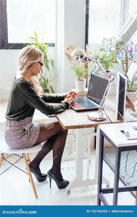 Smiling Blonde Woman Sitting On Office Chair Young Assistant At The