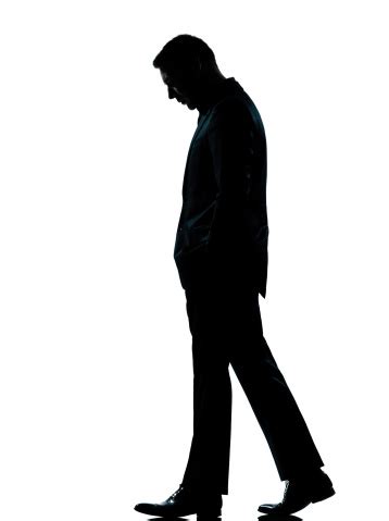 One Business Man Walking Looking Down Silhouette Stock Photo - Download ...