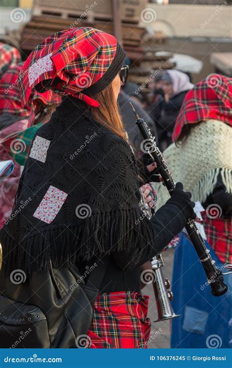 Girl With Red Scottish Kerchief And Shawl Playing Flute Instrument