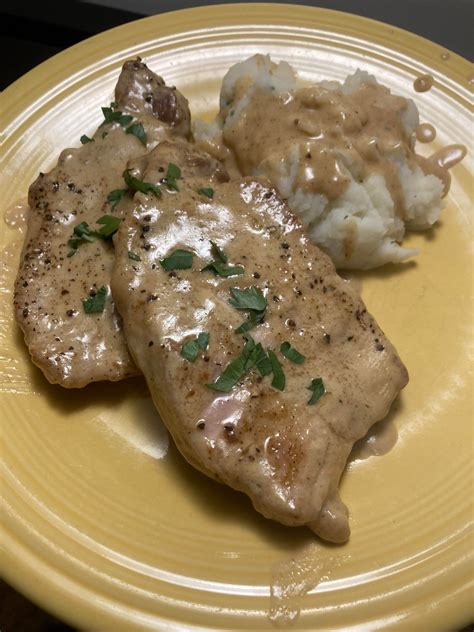 Smothered Pork Chops With A Side Of Mashed Potatoes Dining And Cooking