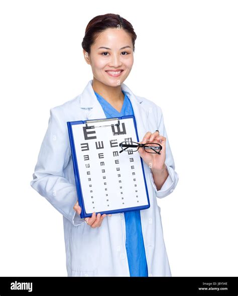 Female Doctor With Eye Chart And Glasses Stock Photo Alamy