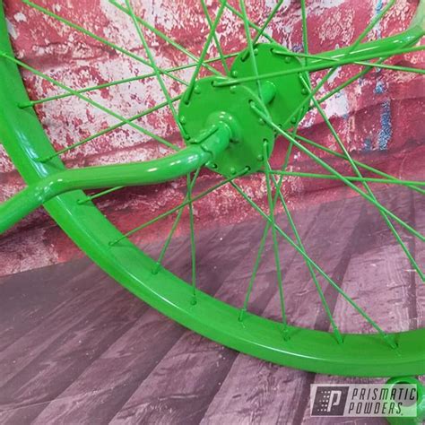 Unicycle Bike Parts finished in Kiwi Green and RAL 2009 | Prismatic Powders