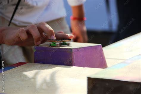 teens hand playing the fingerboard. fingerboard competitions, freestyle and hurdles. Stock Photo ...