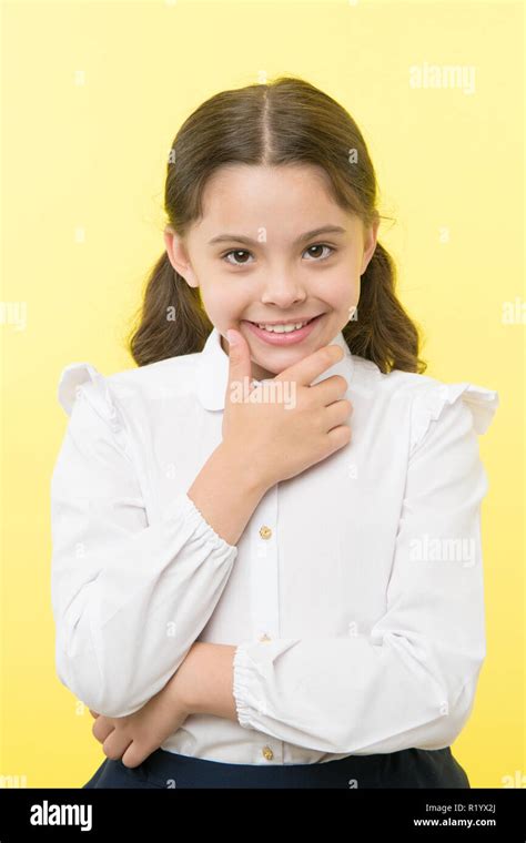 She is planning a prank. Girl school uniform smiling cunning face ...