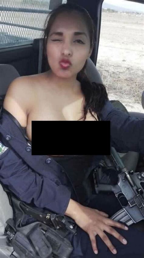 Mexican Police Officer Suspended After Topless Rifle Selfie Taken On