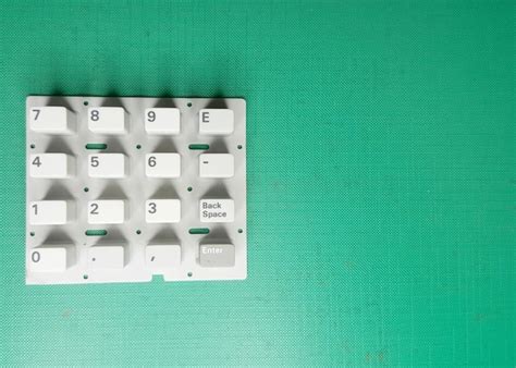 premium photo high angle view  keypad  green table