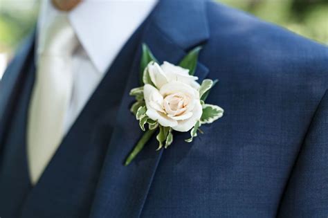 Petite Elegant Groom Boutonniere Of White Majolica Spray Rose And