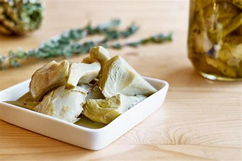 Premium Photo Artichokes Hearts Marinated With Olive Oil And Herbs