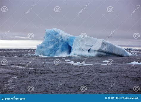 Melting Iceberg in Arctic Ocean Stock Photo - Image of submerged, white ...