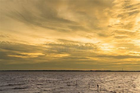 Mesmerizing Golden Hourthe Evening Sky Over The Sea Is Peaceful In