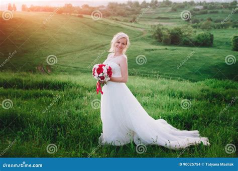 Beautiful Happy Blonde Woman In White Dress Smiling In Sun Light Glow