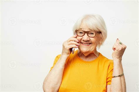 Portrait of an old friendly woman happy lifestyle in yellow t-shirts ...