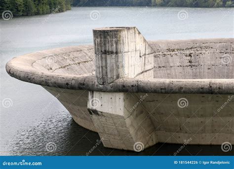 Close Up Of A Big Concrete Overflow Funnel Above The Lake Stock Photo