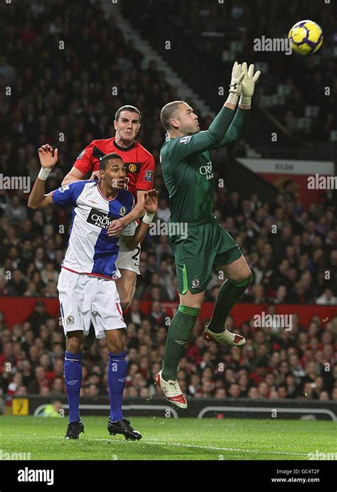 Blackburn Rovers goalkeeper Paul Robinson (right) makes a save as ...